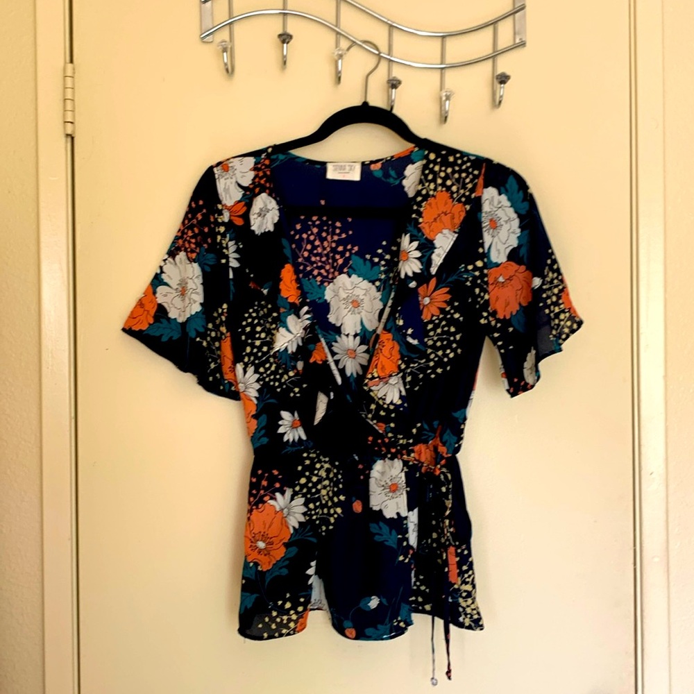 Navy blue floral blouse.